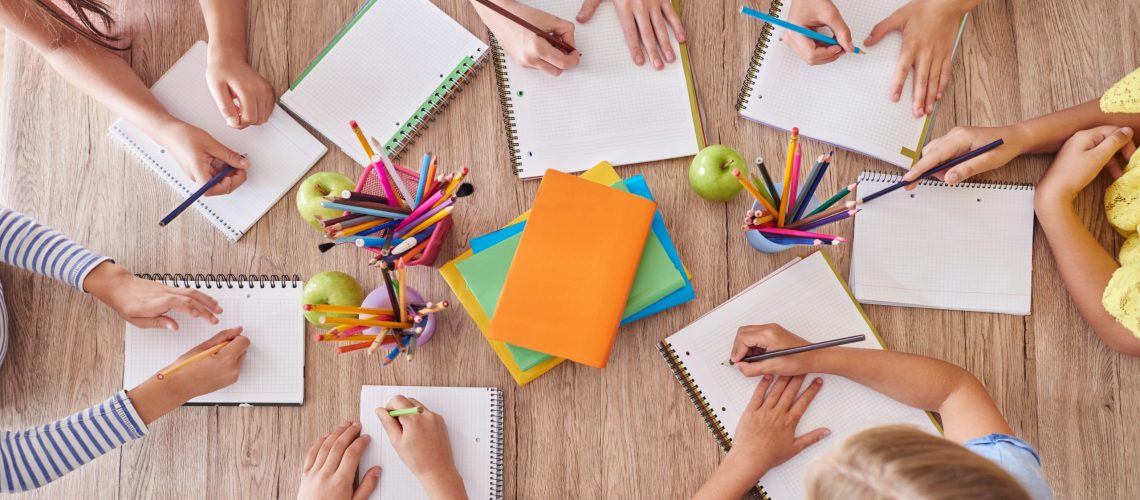 Kids around the school table